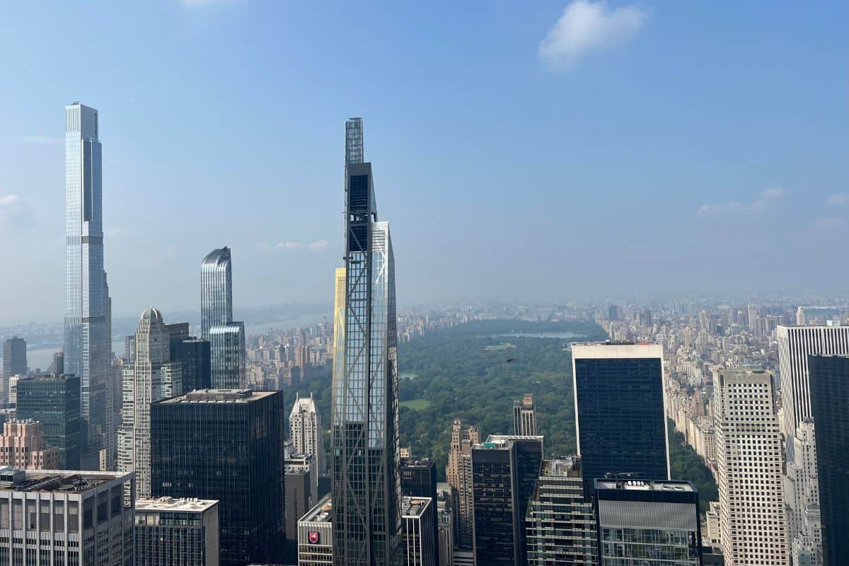 Aerial view of Midtown Manhattan skyscrapers with Central Park and the cityscape visible under a clear blue sky—an iconic scene for any One Day in NYC Itinerary.