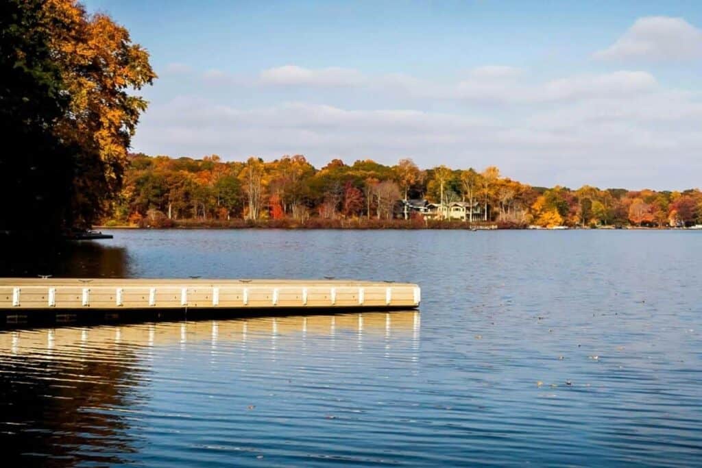 gardner lake dock with fall foliage in the background.
