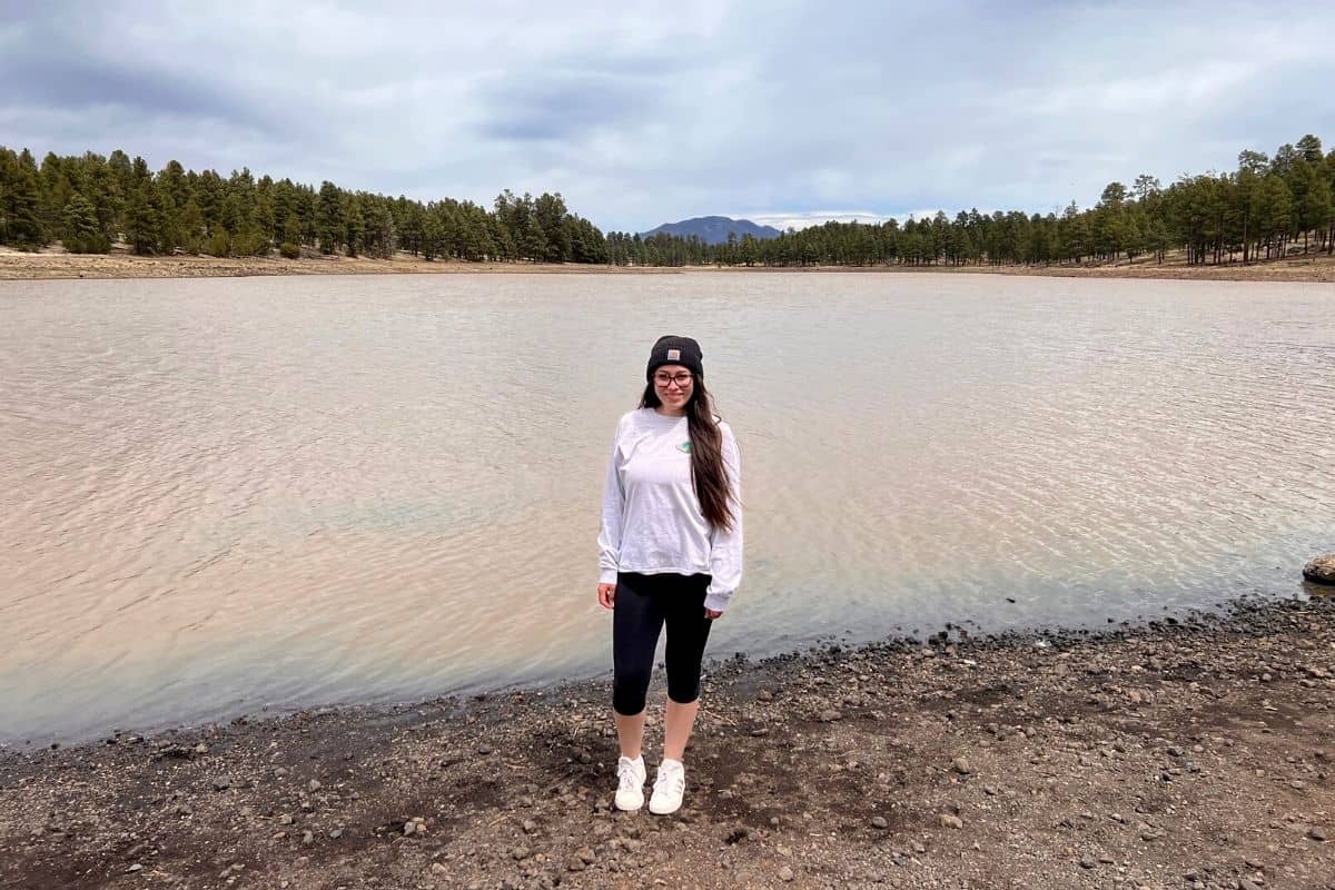 girl standing in front of kaibab lake.