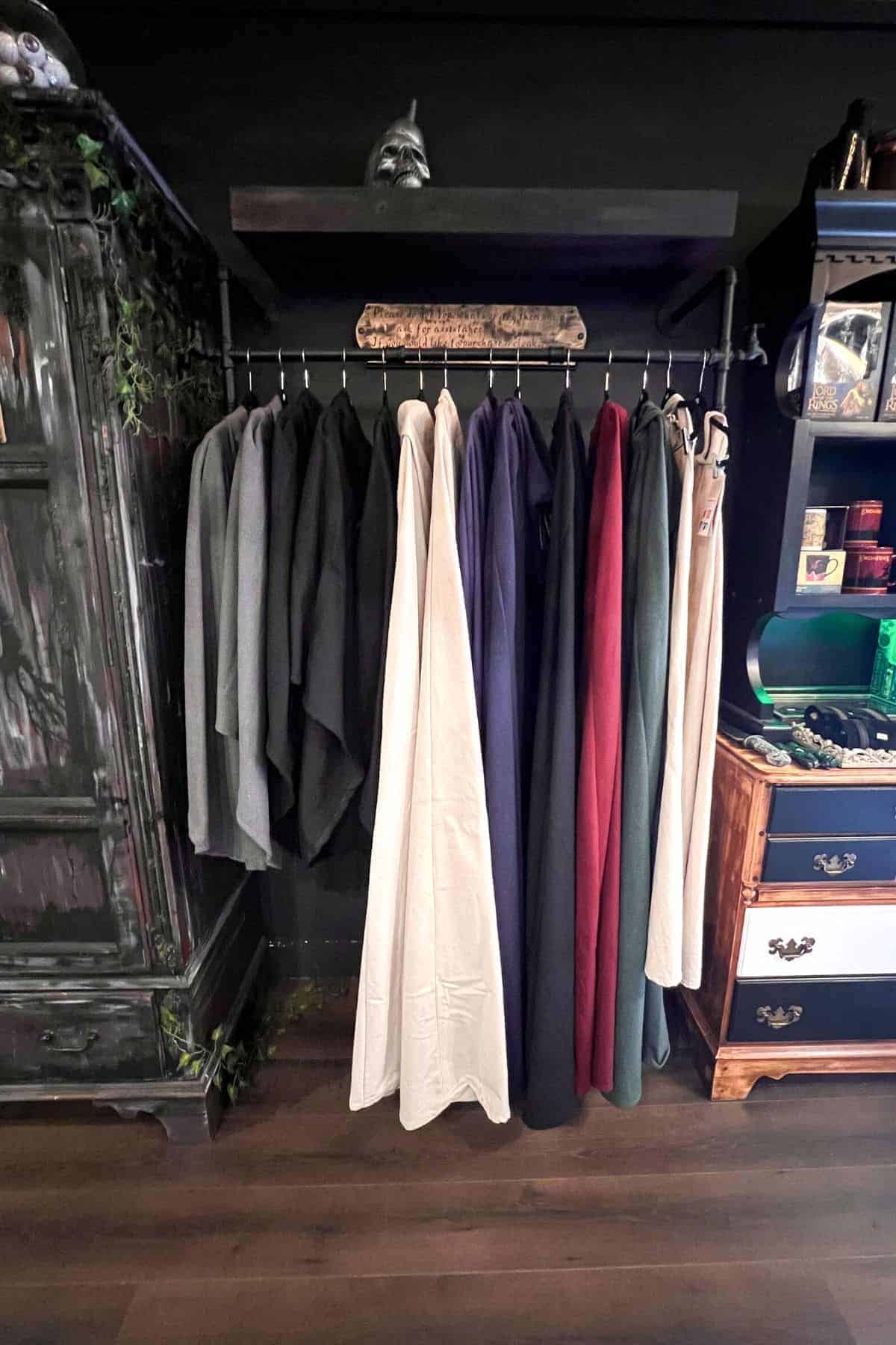 cloaks on a rack in the cloak and wand.