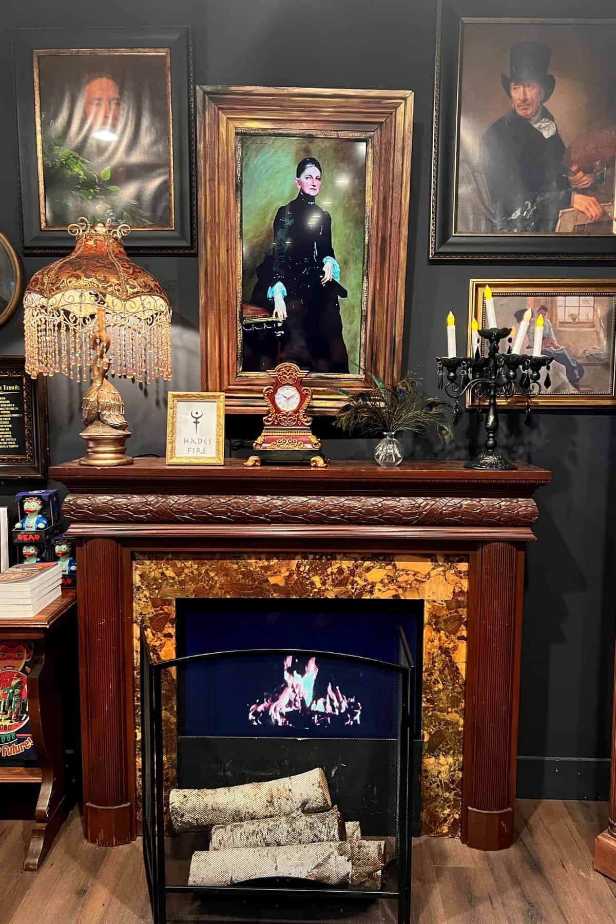 portraits above a fireplace.