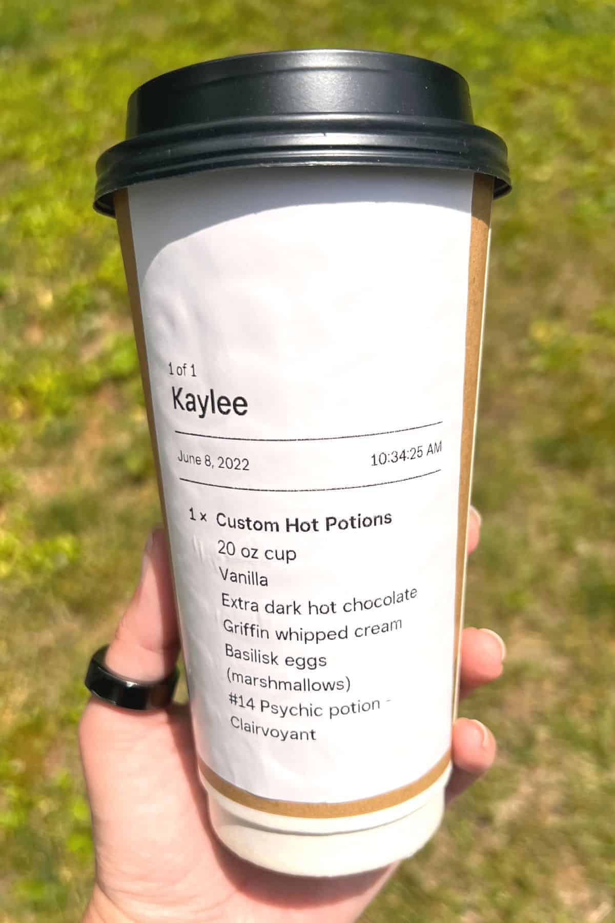 list of potion ingredients on cup.
