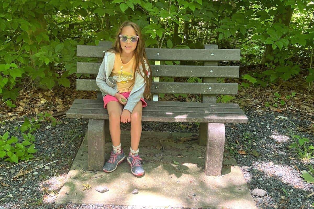 girl sitting on a bench.