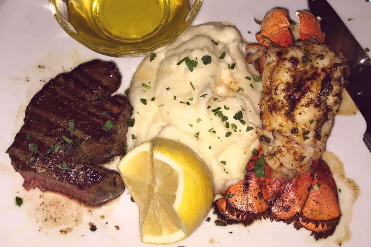 steak, potatoes, and lobster.