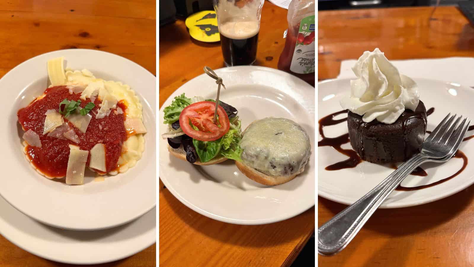Three plates of food: cheese ravioli with marinara sauce, a cheeseburger with lettuce and tomato on a bun, and a chocolate dessert topped with whipped cream and chocolate sauce.