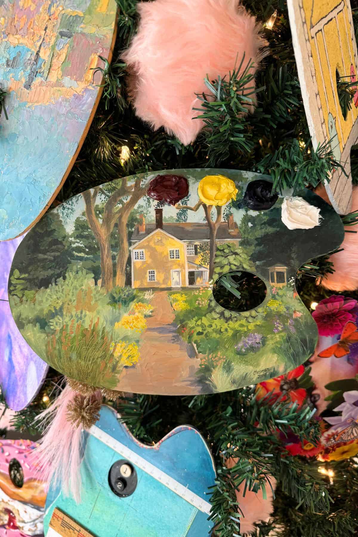 Brightly decorated Christmas tree with painted ornaments and decorative crafts.