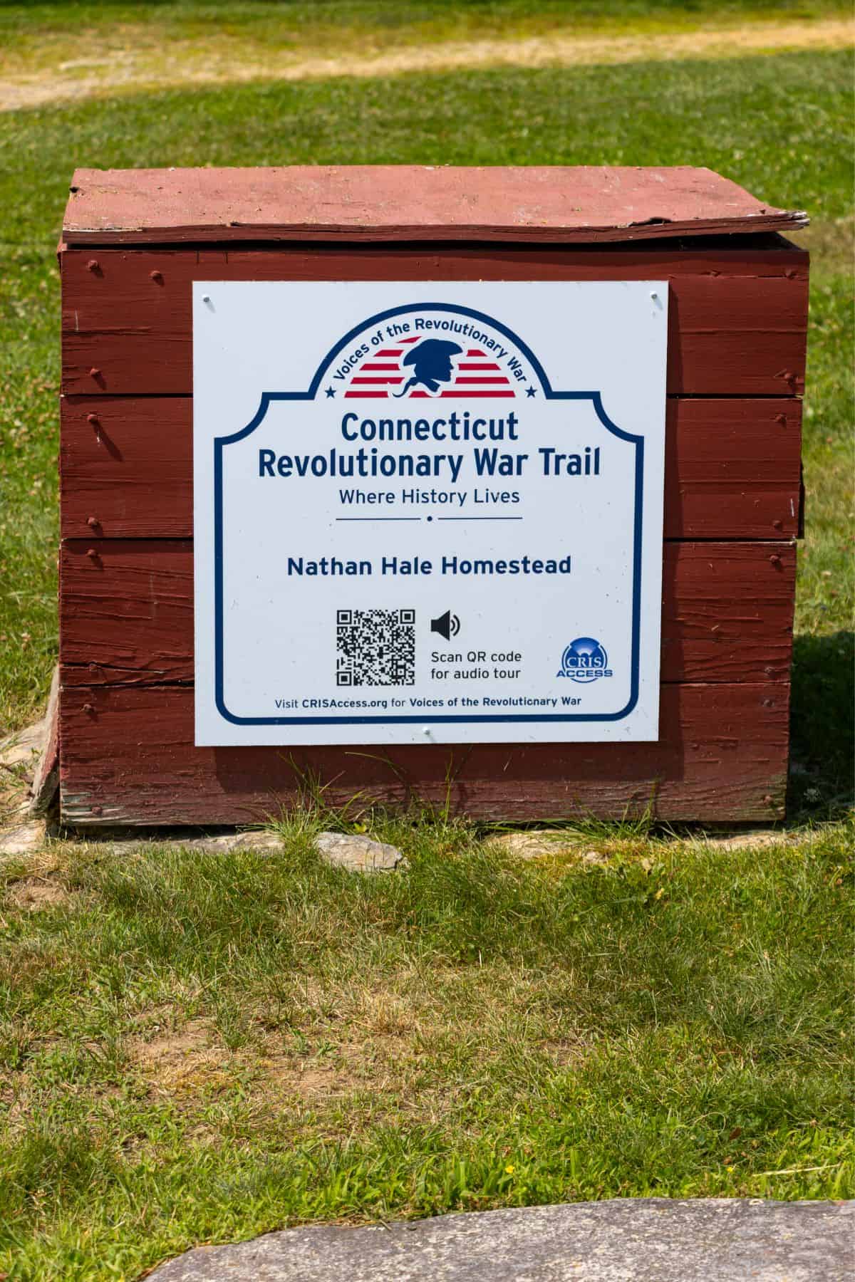 A sign for the Connecticut Revolutionary War Trail at Nathan Hale Homestead, featuring a QR code for an audio tour and website information.